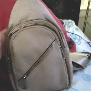 A gold leather Sling bag